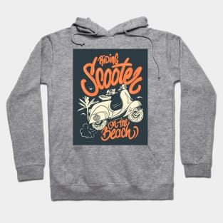 RIDING SCOOTER ON THE BEACH Hoodie